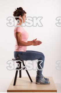 Sitting pose blue jeans pink t shirt of Oxana …